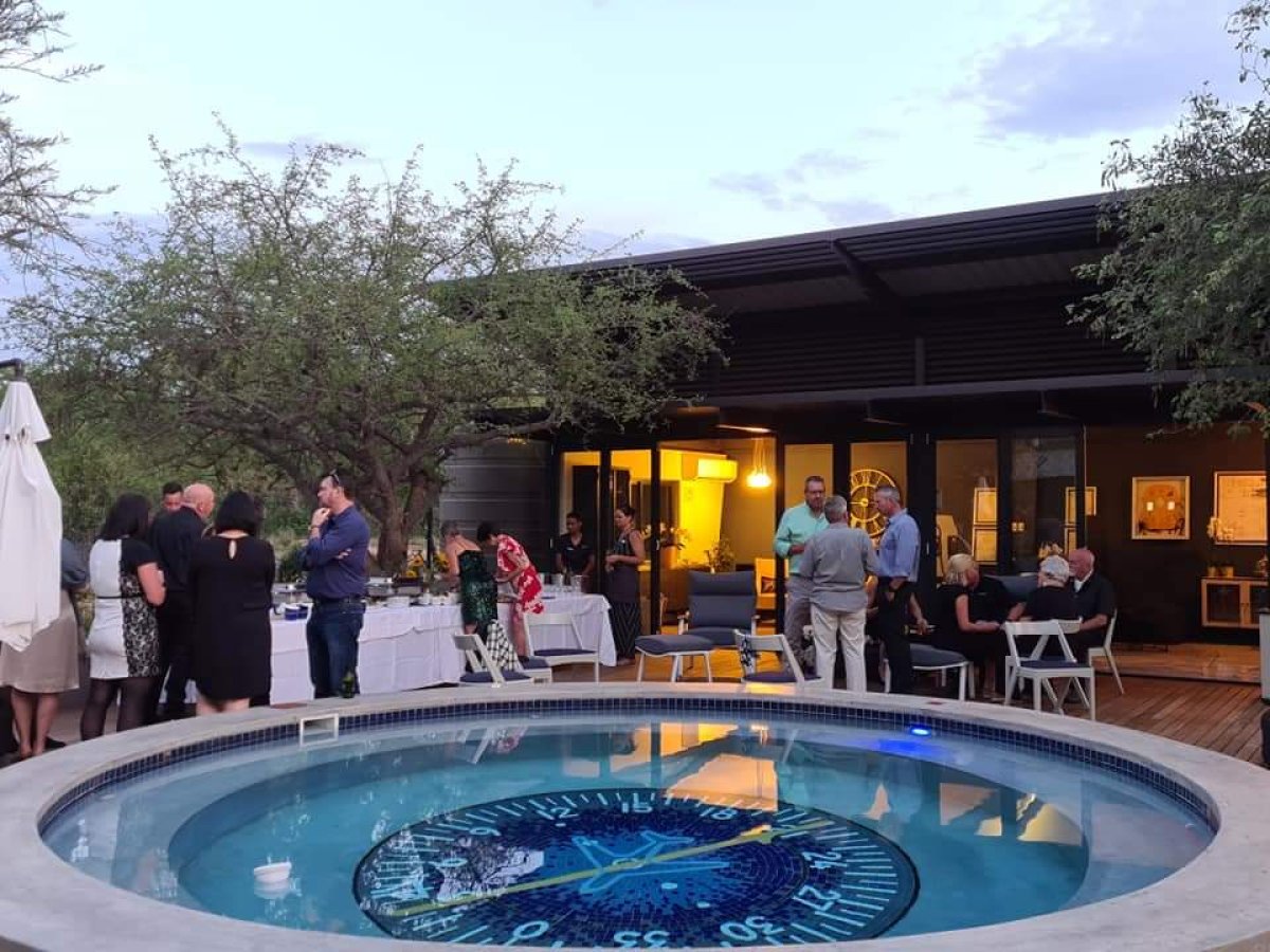 Pool Deck — casual poolside dining at The Runway Restaurant Hoedspruit with aviation compass pool